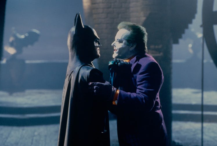 View of American actors Michael Keaton (in costume as Batman) (left) and Jack Nicholson (as the Joke...