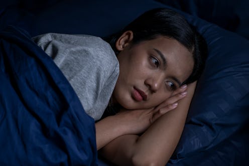 Depressed young Asian woman can not sleep from insomnia