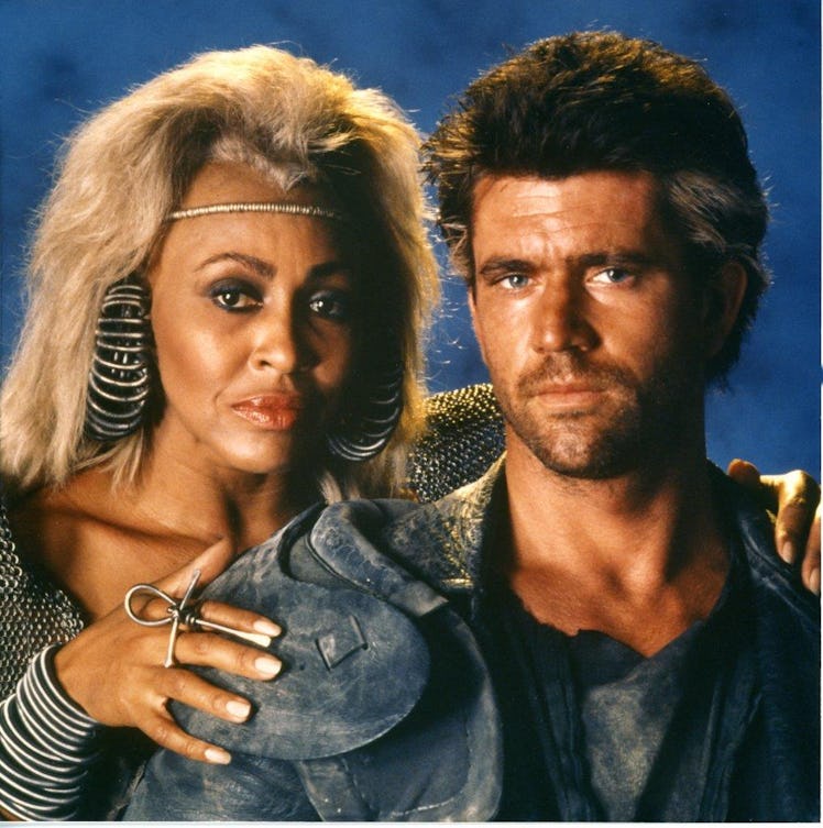 Actor Mel Gibson poses with actor and singer Tina Turner during the filming of Mad Max Beyond Thunde...