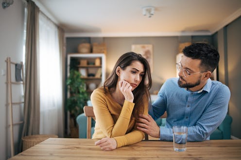Shot of a young husband expressing empathy and compassion for his sad, frustrated wife