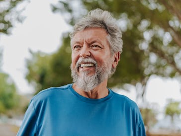 Portrait of a happy senior man in nature