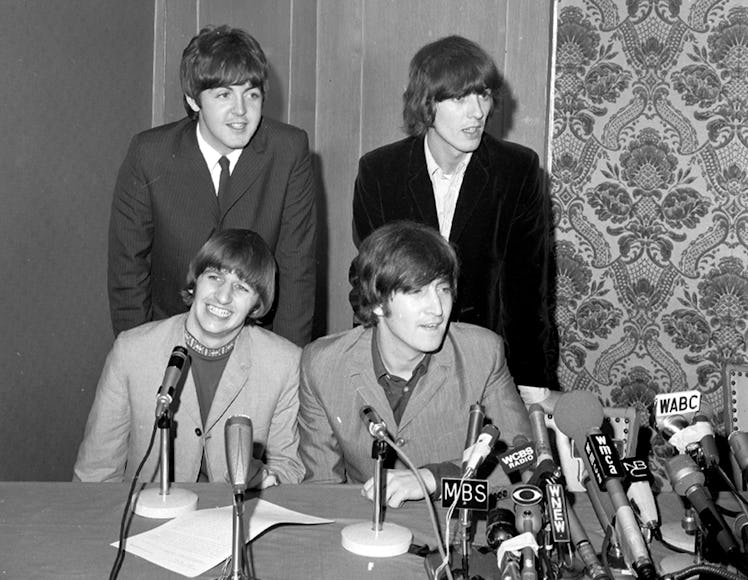 UNITED STATES - AUGUST 14:  The Beatles (seated l. to r.) Ringo Starr and John Lennon, and (standing...