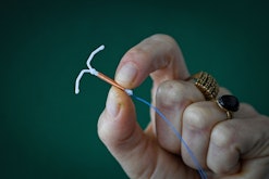 This photograph taken on March 30, 2023, shows a copper IUD (intrauterine device) in Toulouse, south...