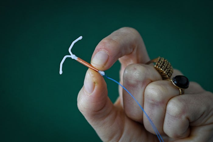 This photograph taken on March 30, 2023, shows a copper IUD (intrauterine device) in Toulouse, south...