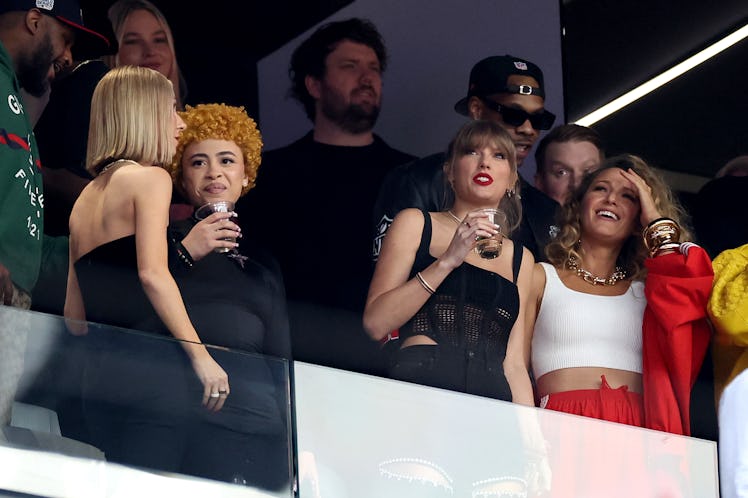 Taylor Swift holding a drink at Super Bowl LVIII between the San Francisco 49ers and Kansas City Chi...