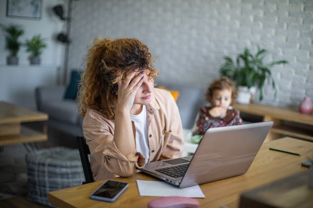 Mother tries to work from home while taking care of her baby