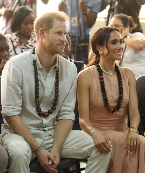 ABUJA, NIGERIA - MAY 10: Duke of Sussex Prince Harry (L) his wife Meghan Markle (R), Duchess of Suss...