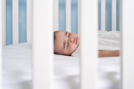 Baby sleeping in a safe crib