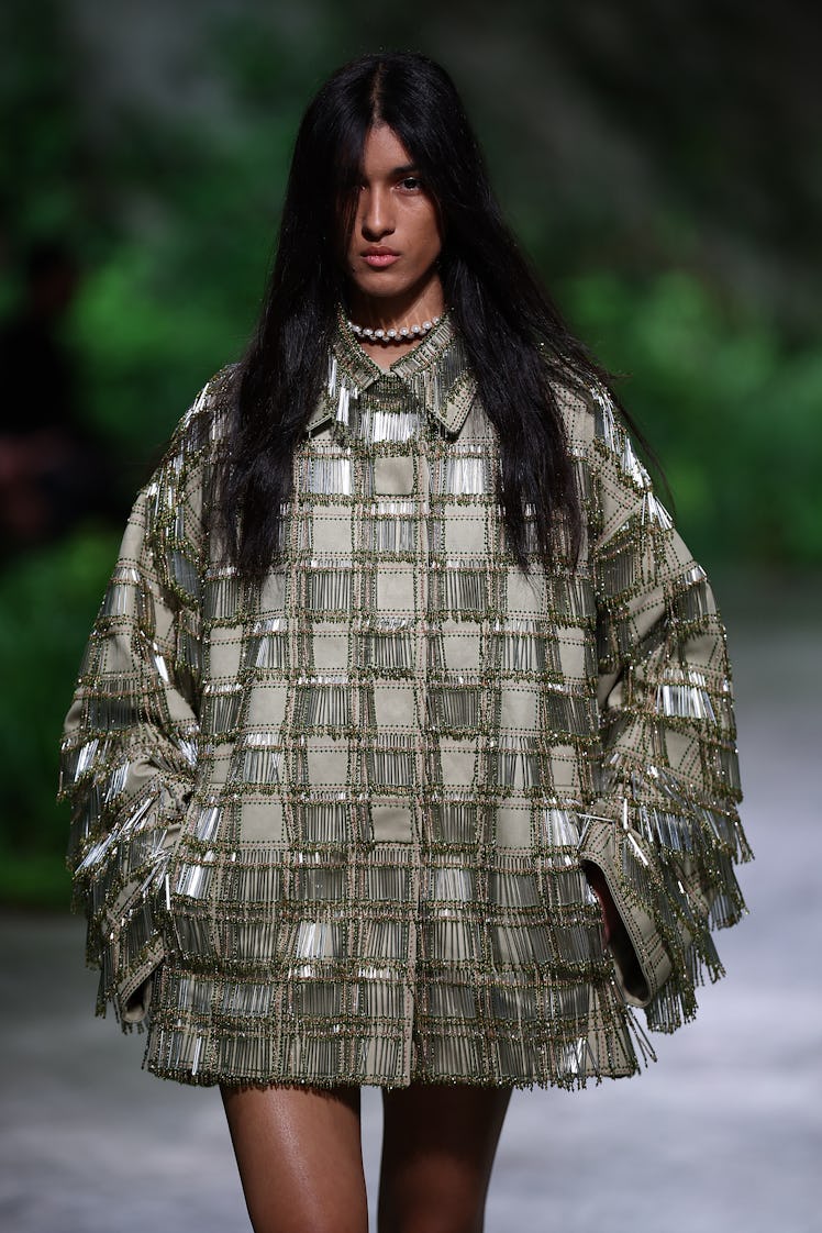 A model presents a creation by Italian fashion house Gucci during their 2024 Cruise Collection Fashi...