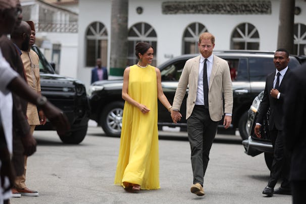 Britain's Meghan, Duchess of Sussex, and Britain's Prince Harry (R), Duke of Sussex arrive at the St...