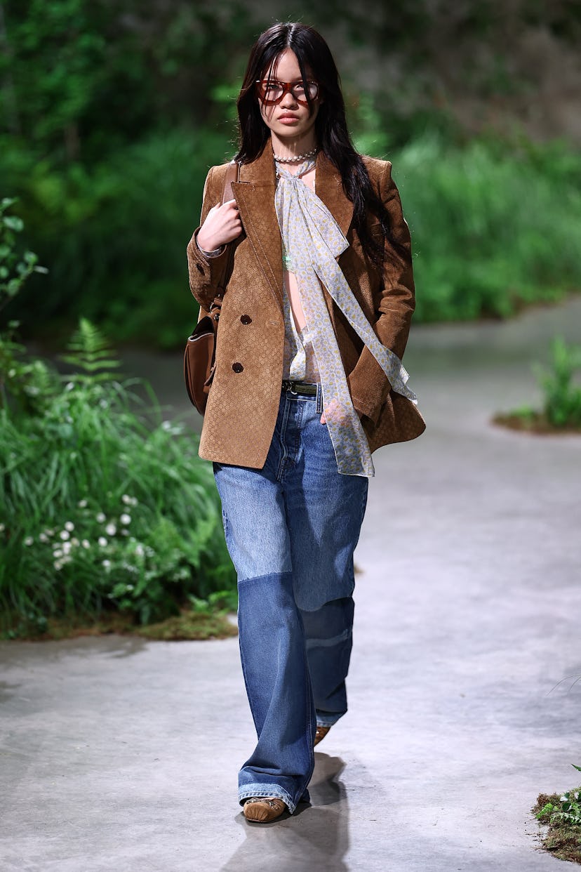 A model presents a creation by Italian fashion house Gucci during their 2024 Cruise Collection Fashi...