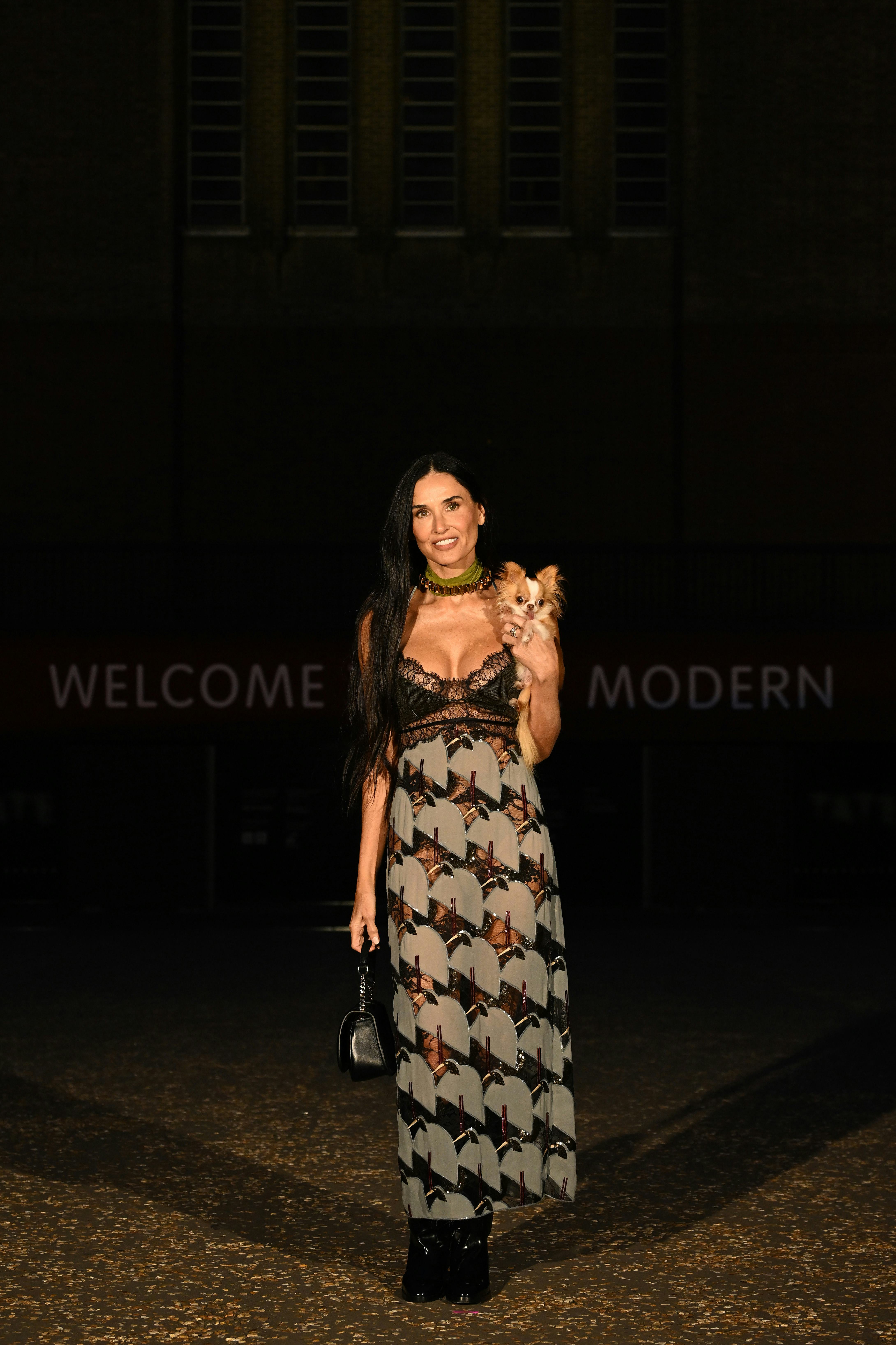 Demi Moore wore a semi-sheer lingerie dress at the Gucci Cruise 2025 show