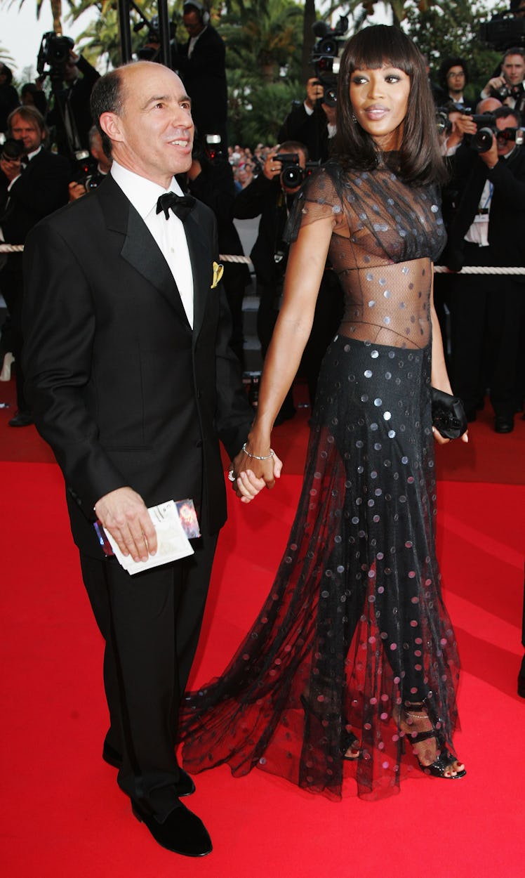 Model Naomi Campbell (R) and unidentified guest attend a premiere promoting the film "Le Scaphandre ...