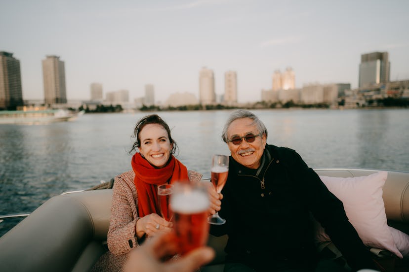 Woman and her father telling dad jokes on a boat