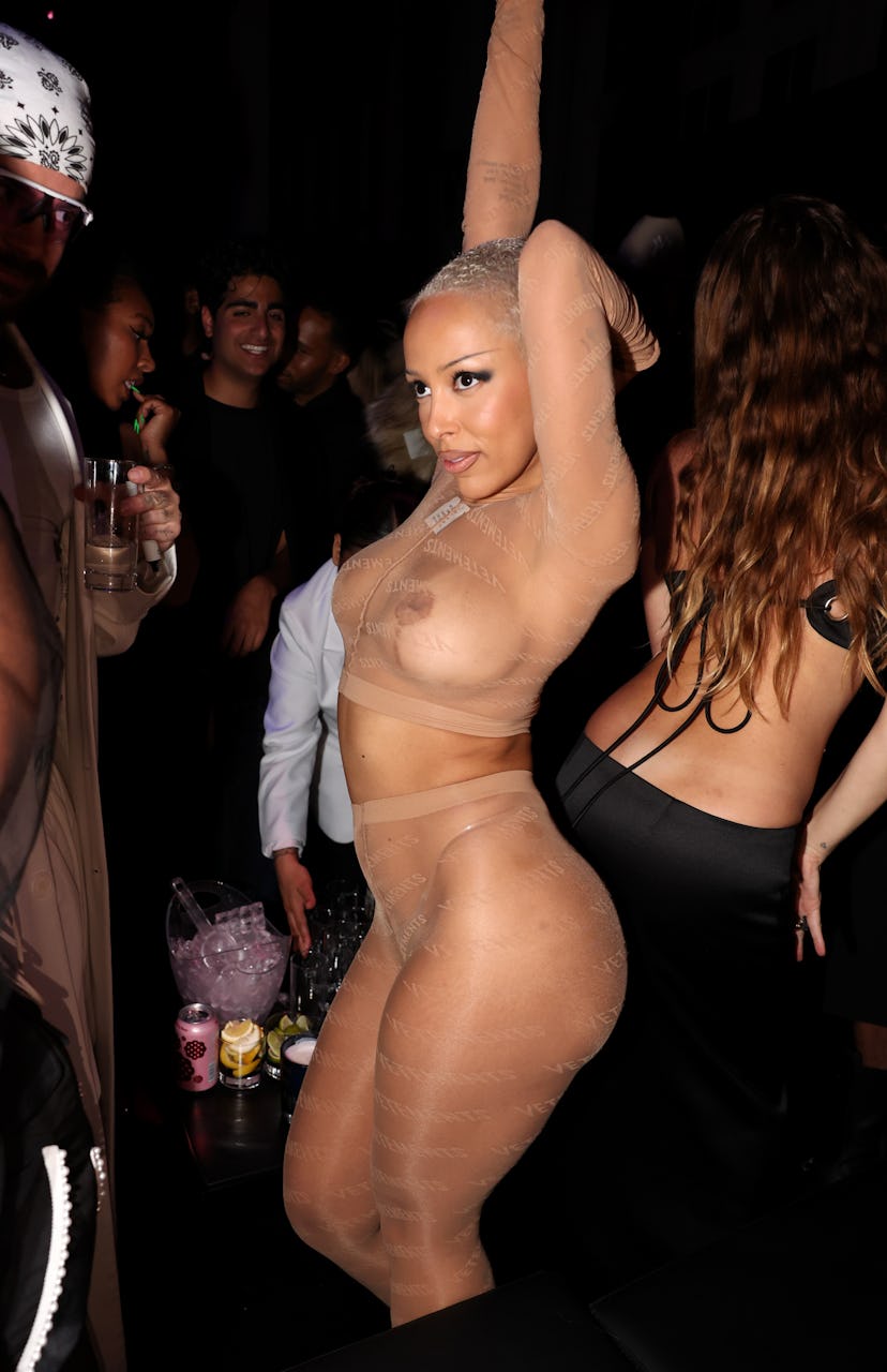 Doja Cat attends The Met Gala After Party, hosted by Richie Akiva wearing a mesh stocking set.
