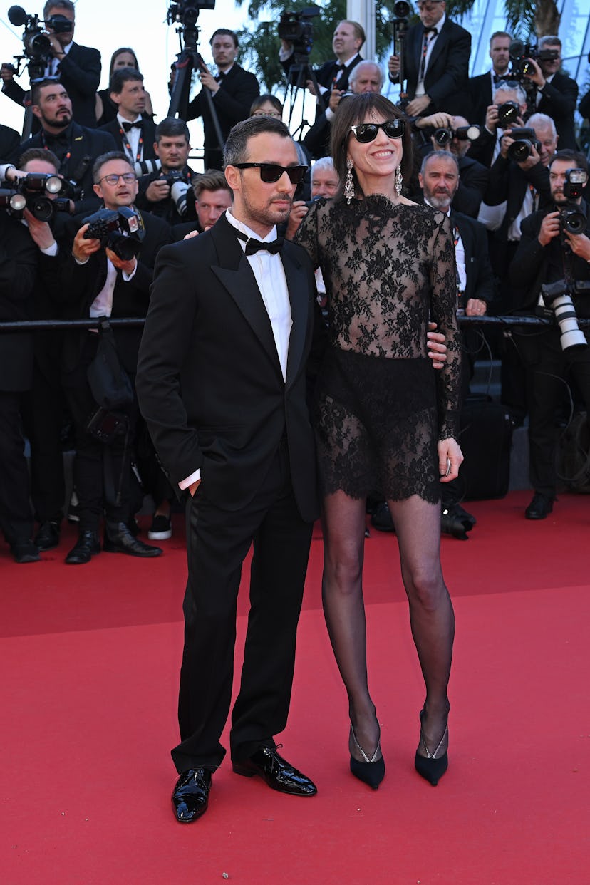 CANNES, FRANCE - MAY 18: Anthony Vaccarello and Charlotte Gainsbourg attend the "Emilia Perez" Red C...