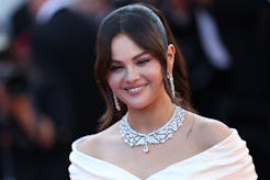 Selena Gomez attends the "Emilia Perez" Red Carpet at the 77th annual Cannes Film Festival in a velv...
