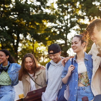 Group of smiling teenagers at skate park