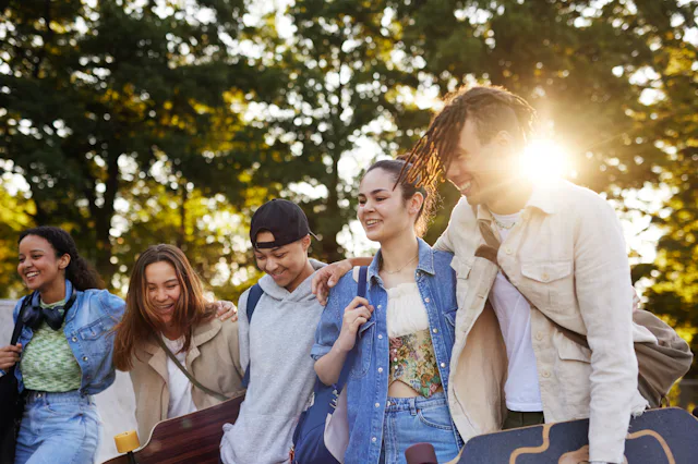 Group of smiling teenagers at skate park