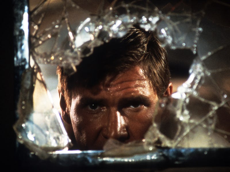 Harrison Ford looks through broken glass in a scene from the film 'Indiana Jones And The Temple Of D...