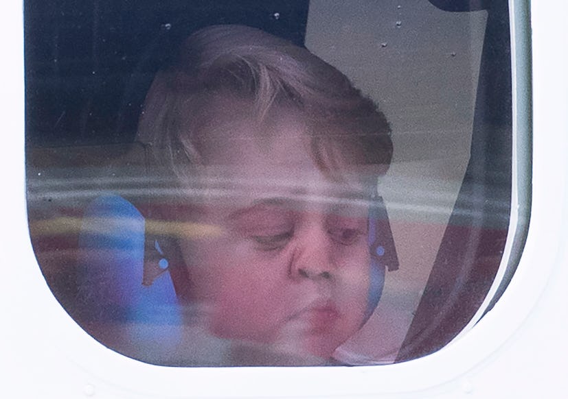 VICTORIA, BC - OCTOBER 01:  Prince George of Cambridge presses his face against the window as he lea...