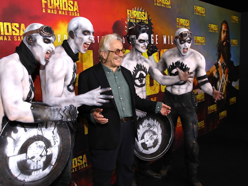 TORONTO, ONTARIO - MAY 21: George Miller (C) poses with a group of War Boys during the Toronto premi...