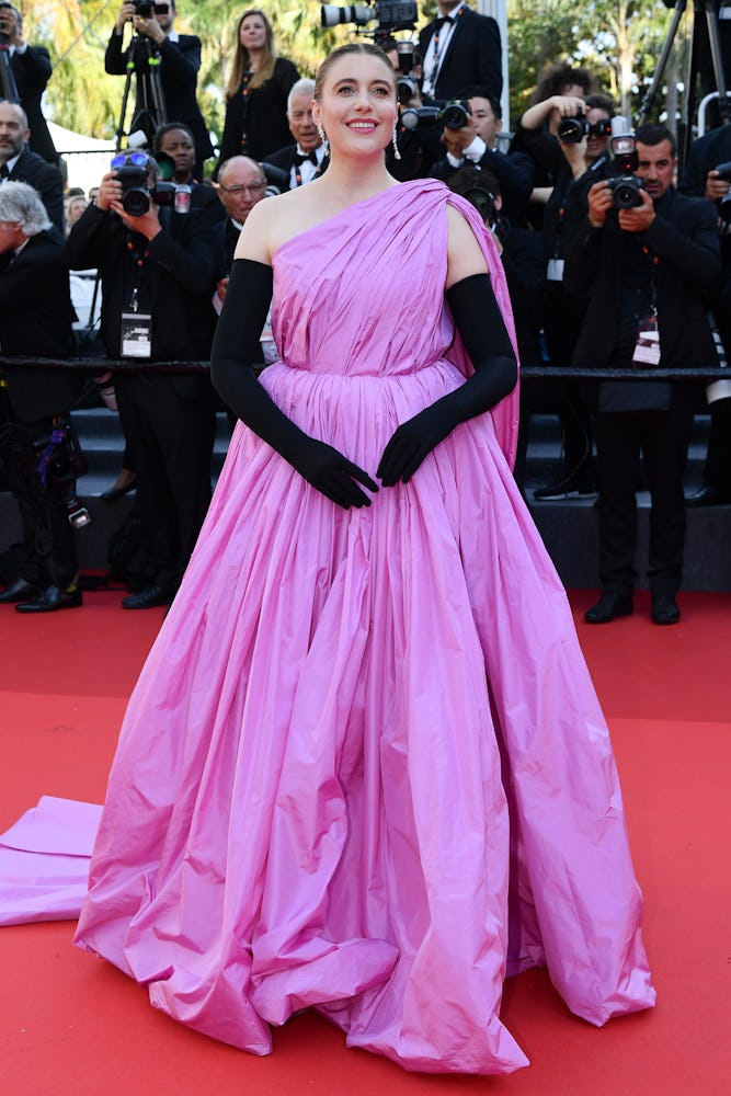 Greta Gerwig visits the "L'Amour Ouf" (Beating Hearts) Red carpet at the 77th Cannes Film Festival