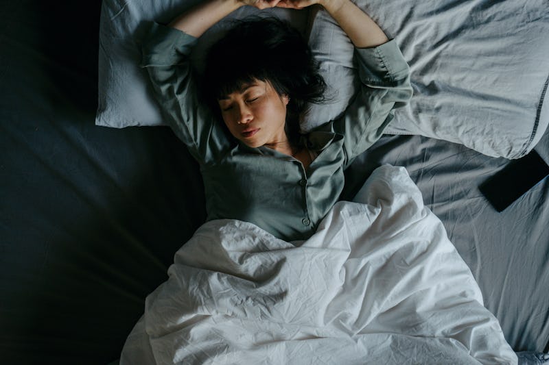 Portrait of a beautiful Japanese woman sleeping in her bed