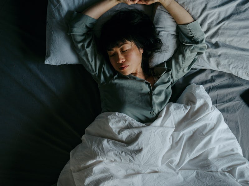 Portrait of a beautiful Japanese woman sleeping in her bed