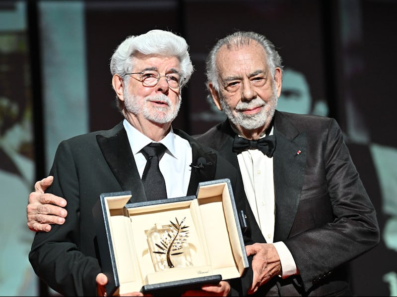 CANNES, FRANCE - MAY 25: Francis Ford Coppola (R) presents the Honorary Palme D’Or Award to George L...
