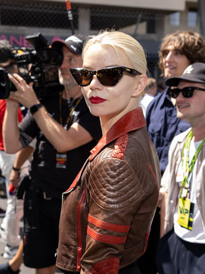 Anya Taylor-Joy wears a brown moto jacket and bodysuit to attend the F1 Grand Prix of Monaco at Circ…