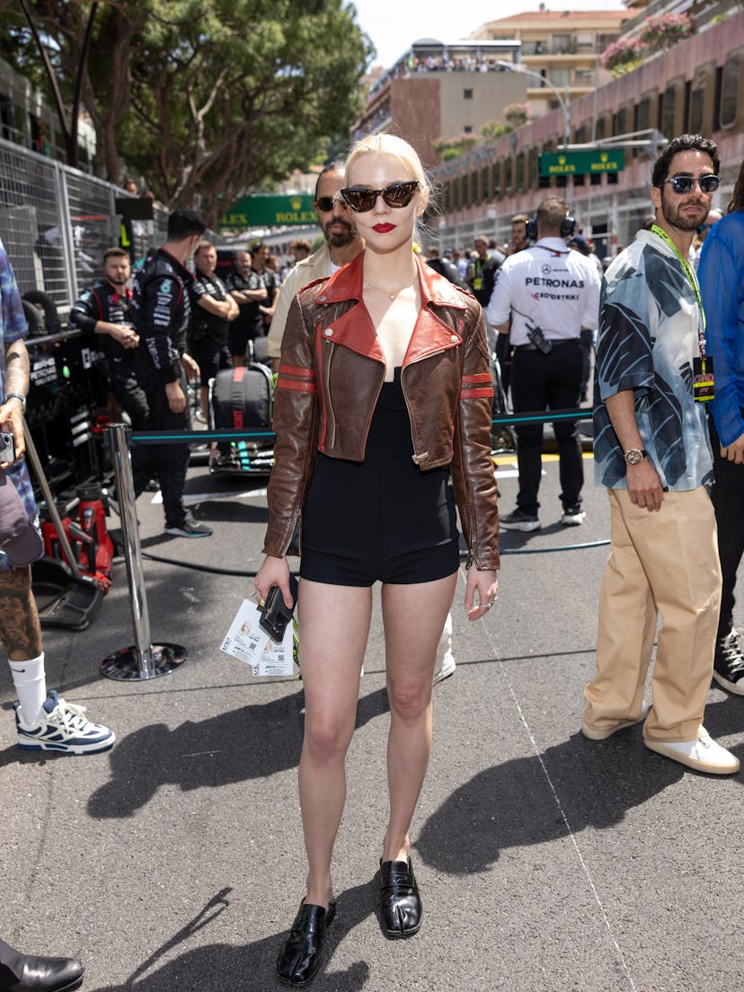 Anya Taylor-Joy wears a brown moto jacket and bodysuit to attend the F1 Grand Prix of Monaco at Circ…