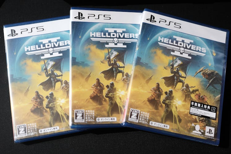 Copies of Sony Corp. PlayStation 5 video game Helldivers 2 displayed at the company's headquarters i...