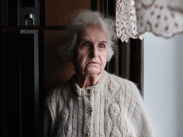 Sad depressed elderly woman at home, upset lonely senior woman. Older people and depression
