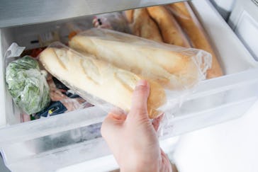 Putting in,  taking out baguettes from the freezer