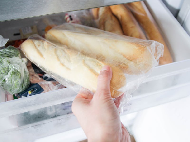 Putting in, taking out baguettes from the freezer