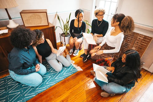 Group of teenage generation Z girls reading books together.