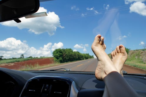 Barefoot with your feet on the dashboard