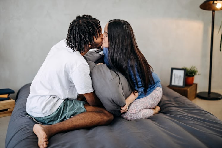 couple kissing in an aura energy exchange