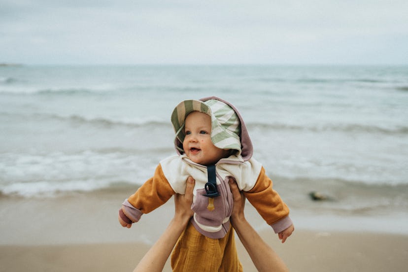 A list of water-inspired girl names gave this baby her name as she visits the beach she's named afte...