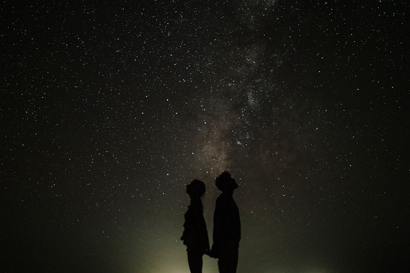A couple looking up at the night sky to come up with star-inspired girl names