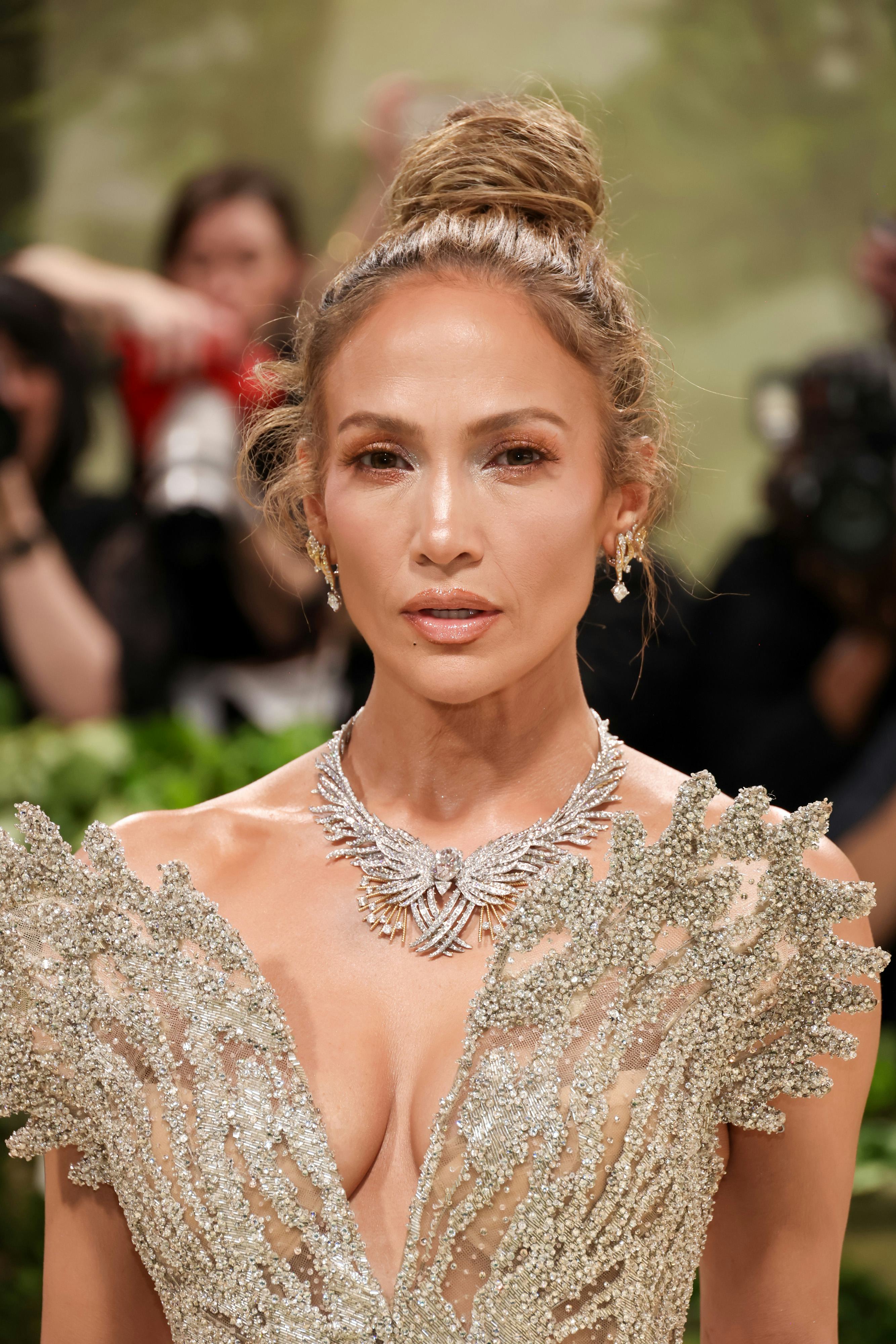 Jennifer Lopez styled her hair in a tousled topknot at the 2024 Met Gala.