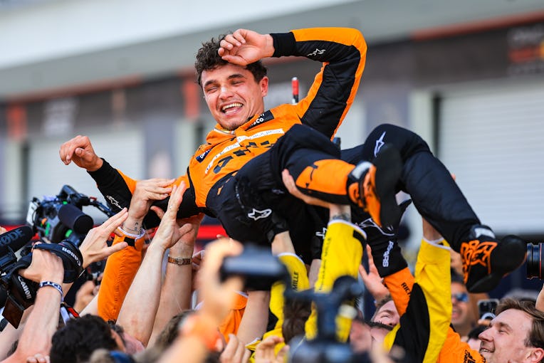 MIAMI, FLORIDA - MAY 5:  Lando Norris of Great Britain and McLaren celebrates with the team in parc ...