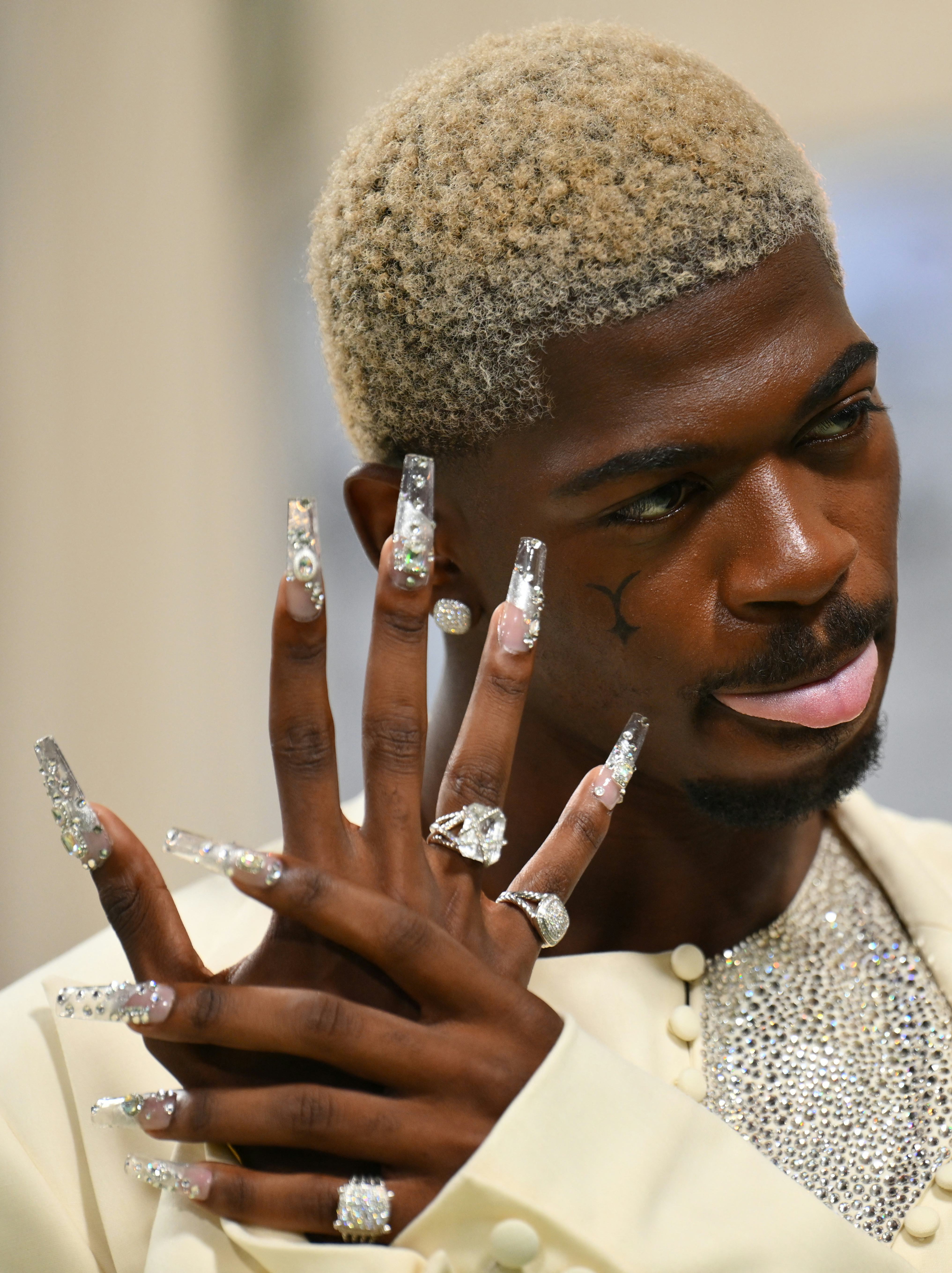 Lil Nas X wore XXL crystal nails to the 2024 Met Gala.