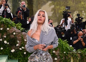 Kim Kardashian wearing a cardigan with her gown at the 2024 Met Gala.