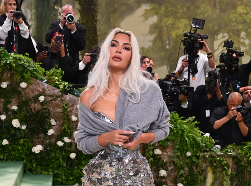 Kim Kardashian wearing a cardigan with her gown at the 2024 Met Gala.