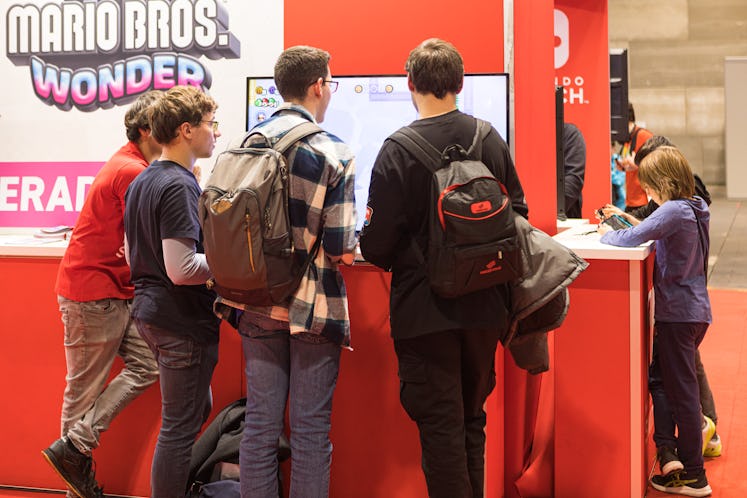 MADRID, SPAIN - NOVEMBER 04: People visit the Nintendo Switch booth at the Madrid Cómic Pop Up Fair ...