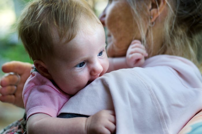 Grandmother Holding Newborn girl