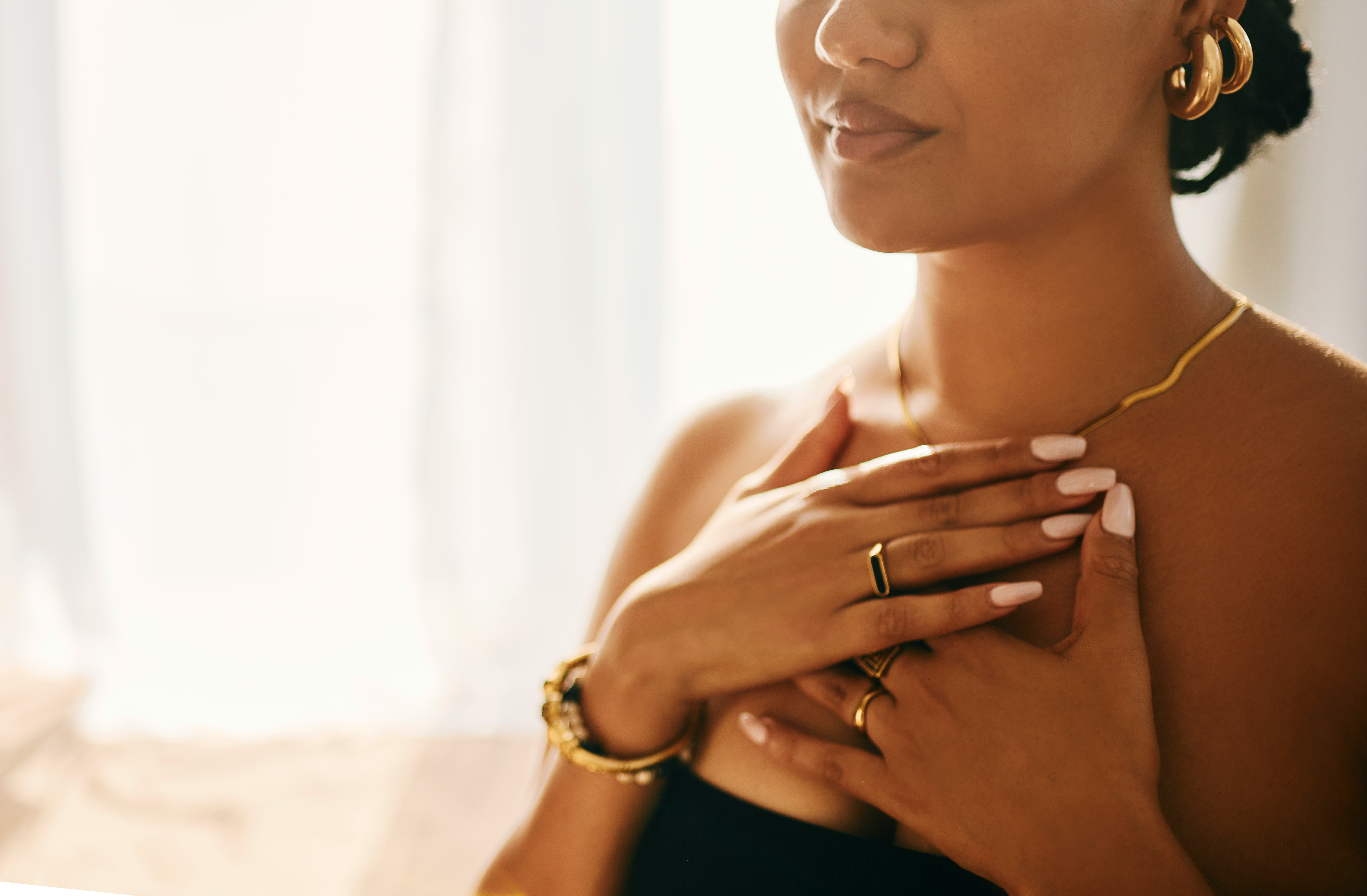 A woman deep in meditation as she listens to positive vibes quotes