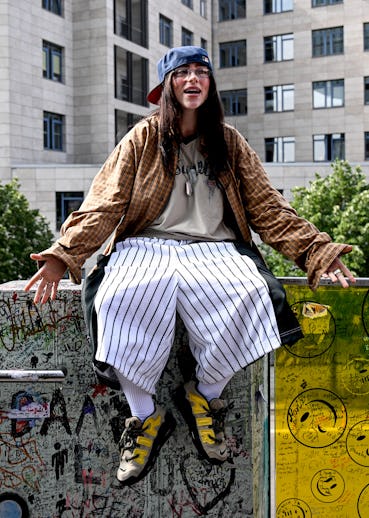 07 June 2024, Berlin: The American singer Billie Eilish is sitting on a ledge of a staircase railing...